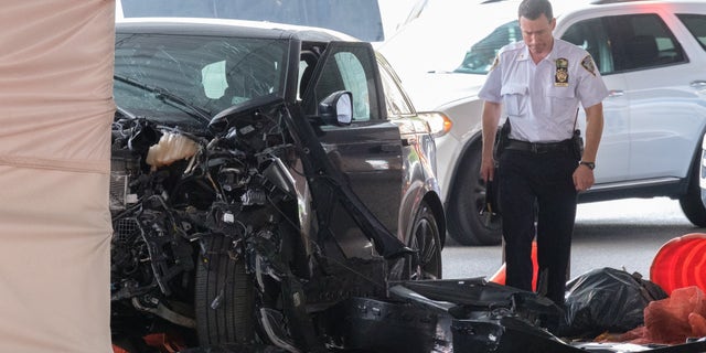 Police investigate after a Range Rover struck a pillar under the Gowanus Expressway on 3rd Avenue near 52nd Street in Brooklyn, New York City on Friday, July 29, 2022.