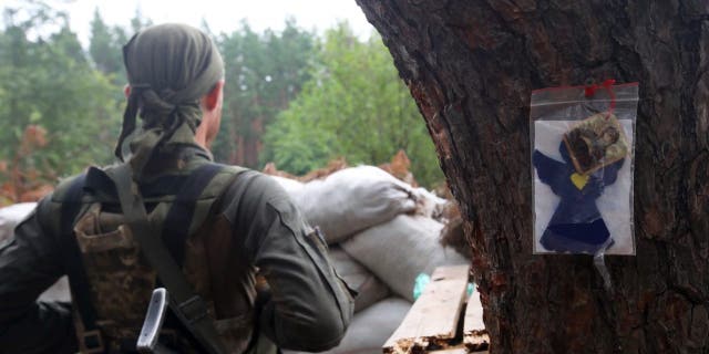 A National Guard serviceman is on duty outside Kharkiv, Kharkiv Region, northeastern Ukraine. 