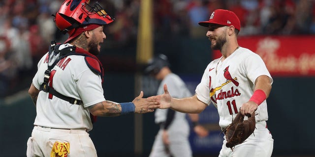 Yadier Molina (4) and Paul DeJong (11) of the St. Louis Cardinals celebrate after beating the New York Yankees at Busch Stadium Aug. 5, 2022, in St Louis.