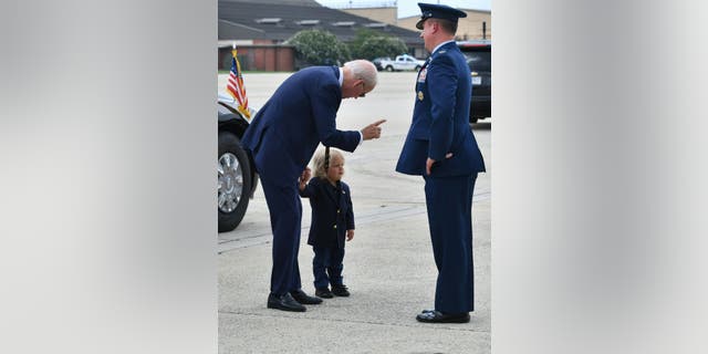 President Biden walks with his grandson Beau Biden at Joint Base Andrews in Maryland on Aug. 10, 2022.