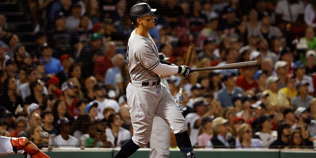 Aaron Judge of the New York Yankees watches his solo home run against the Boston Red Sox during the third inning at Fenway Park Aug. 12, 2022, in Boston.