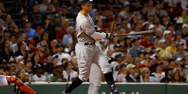 Aaron Judge of the New York Yankees watches a solo home run against the Boston Red Sox in the third inning on August 12, 2022 at Fenway Park in Boston.