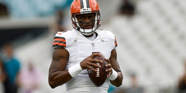 Cleveland Browns quarterback Deshaun Watson, #4, stands on the field during a preseason game between the Cleveland Browns and the Jacksonville Jaguars on Aug. 12, 2022 at TIAA Bank Field in Jacksonville, Florida.