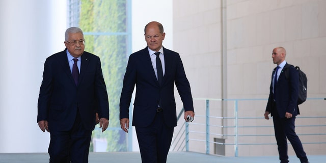 Olaf Scholz and Mahmoud Abbas arrive for a press conference in Berlin on Tuesday, August 16, 2022. (Krisztian Bocsi / Bloomberg via Getty Images)