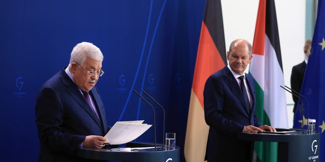 Mahmoud Abbas, Palestinian Authority president, left, and Olaf Scholz, Germany's chancellor, during a news conference in Berlin, Germany, on Tuesday, Aug. 16, 2022. Scholz and Abbas were speaking following their bi-lateral meeting in the German capital.