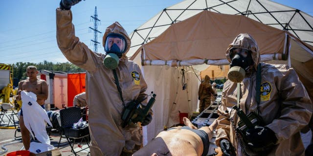 Rescuers from the Ukrainian Ministry of Emergency participate in an exercise in the city of Zaporizhzhia on August 17, 2022, in the event of a possible nuclear accident at the Zaporizhzhia nuclear power plant located near the city.