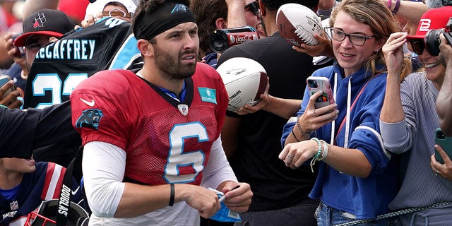 Carolina quarterback Baker Mayfield signs autographs for fans after practice. The New England Patriots hosted the Panthers in a joint practice session at Gillette Stadium. 