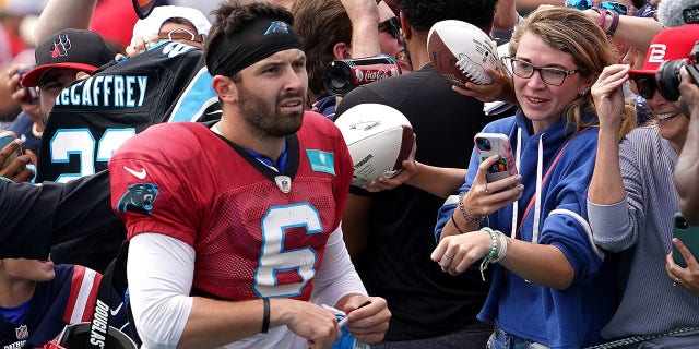 Carolina quarterback Baker Mayfield signs autographs for fans after practice. The New England Patriots hosted the Panthers in a joint practice session at Gillette Stadium. 