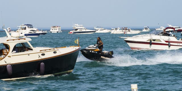 A boater in a dinghy spotted a man's body floating in Lake Michigan's 