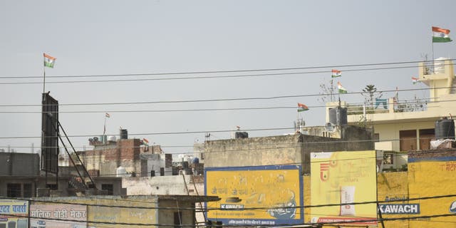 GHAZIABAD, INDIA - AUGUST 18: Indian national flags seen on rooftops after the recently concluded 75th Independence Day celebrations, at Lal Kuan on August 18, 2022 in Ghaziabad, India. Government has urged people to fly flags on every house as part of Har Ghar Tiranga campaign. 