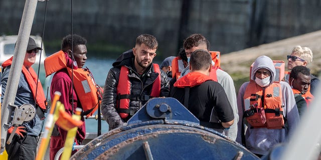 August 23, 2022: Border forces escorted 100 migrants to Dover on August 23, 2022, after being picked up in the English Channel.  Border Force and Army officials assisted migrants ashore at Dover Docks in Dover, UK.