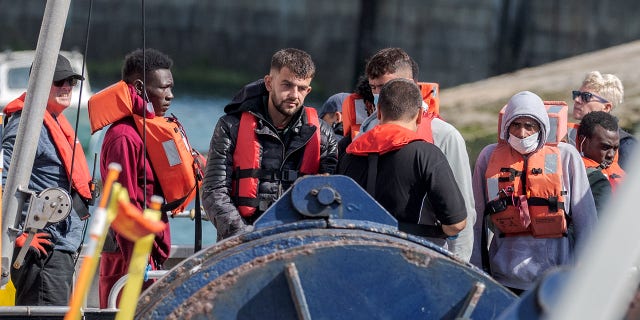 Border forces escorted 100 migrants to Dover after they were picked up in the English Channel.