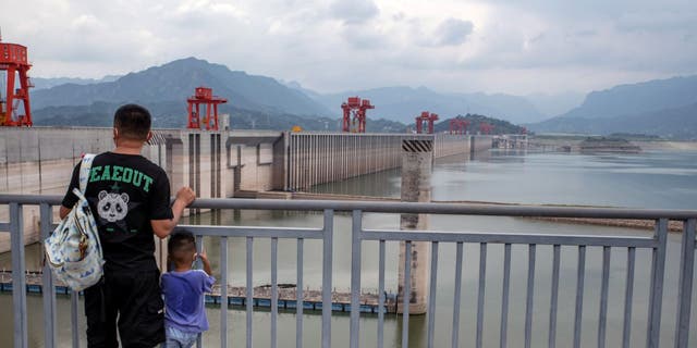 The Three Gorges Dam and low water levels along the Yangtze River in Yichang, China, Tuesday, August 23, 2022.  