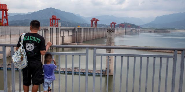 The Three Gorges Dam and low water levels along the Yangtze River in Yichang, China, Tuesday, August 23, 2022.  