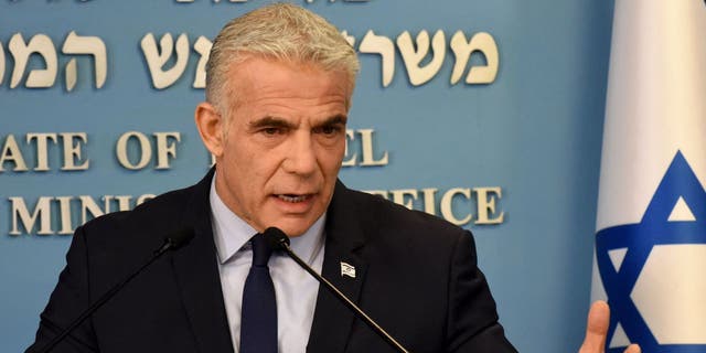 Israeli Prime Minister Yair Lapid speaks at a security briefing on Iran for the foreign press at the Prime Minister's office in Jerusalem on August 24, 2022. 