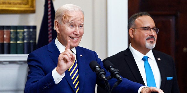 President Joe Biden announces student loan relief with Education Secretary Miguel Cardona on Aug. 24, 2022, at the White House.