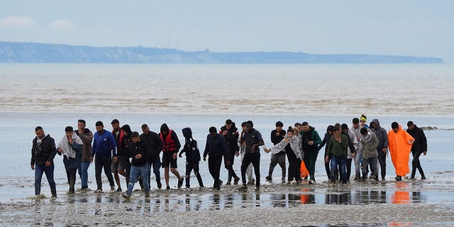 A group of suspected migrants landed in Dungeness, Kent, on August 25, 2022, after a small boat accident in the English Channel.