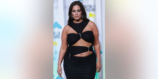 Ashley Graham rocked a black cut-out gown on the red carpet at the VMAs.
