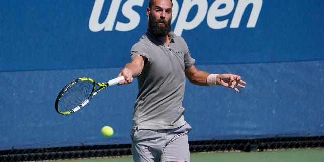 France's Benoit Paire returns to Britain's Cameron Norrie during their first round match of the 2022 US Open at the USTA Billie Jean King National Tennis Center in New York August 30, 2022.