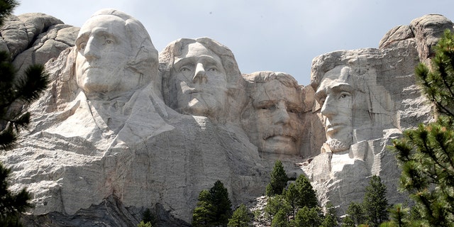 The busts of U.S. presidents George Washington, Thomas Jefferson, Theodore Roosevelt and Abraham Lincoln tower over the Black Hills at Mount Rushmore National Monument on July 1, 2020 in Keystone, South Dakota. 