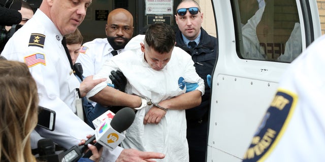 Victor Pena is escorted out of Charlestown District Court following his arraignment on kidnapping charges on January 23, 2019 in Boston, Massachusetts.