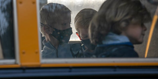 Children board the bus to school on Sept. 23, 2020 in Stamford, Connecticut.  
