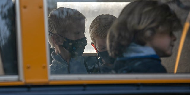 Children board the bus to school on Sept. 23, 2020 in Stamford, Connecticut.  