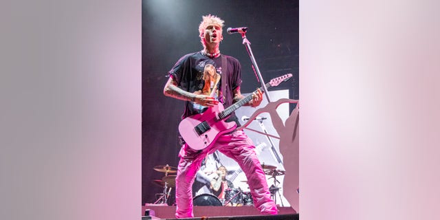 Machine Gun Kelly  performs on day 1 of 2021 Music Midtown at Piedmont Park on September 18, 2021 in Atlanta, Georgia.