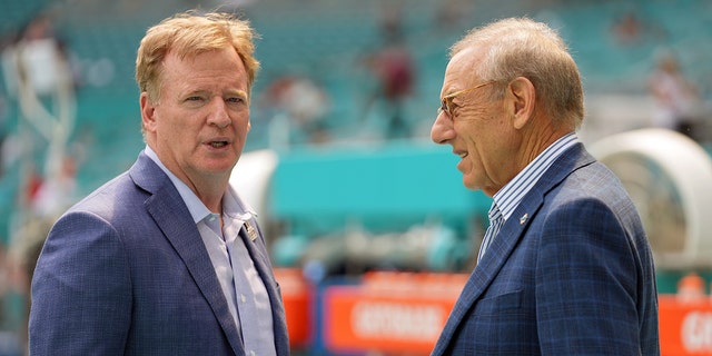 NFL Commissioner Roger Goodell, left, speaks with Dolphins owner Stephen Ross before the game against the Indianapolis Colts at Hard Rock Stadium in Miami Gardens, Fla., on Oct. 3, 2021.
