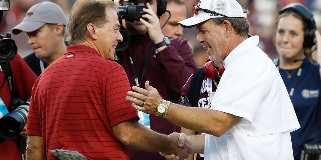 Nick Saban of the Crimson Tide and Jimbo Fisher of the Aggies meet before the game at Kyle Field on Oct. 9, 2021, in College Station, Texas.