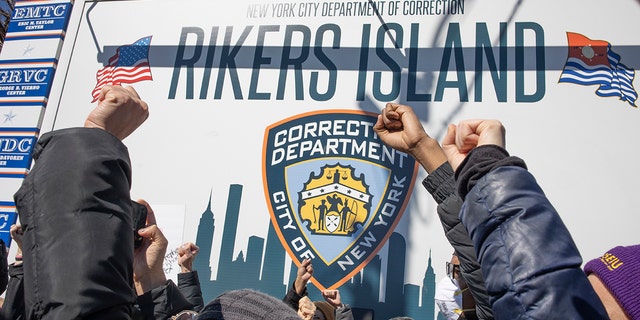 Criminal justice activists demand that Rikers Island jail and the system that they claim discriminates against the poor by demanding bail before trial end, on February 28, 2022, at the gate to Rikers Island in Queens, New York.  