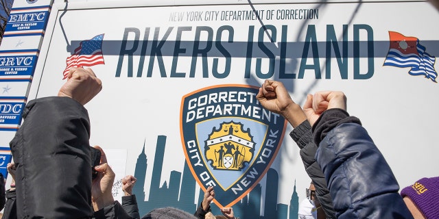 Criminal justice activists demand that Rikers Island jail and the system that they claim discriminates against the poor by demanding bail before trial end, on February 28, 2022, at the gate to Rikers Island in Queens, New York.
