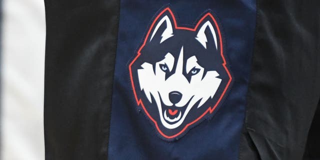 The Connecticut Huskies logo on a pair of shorts during a college basketball game at the Capital One Arena. UConn's defensive coordinator is taking a leave of absence.