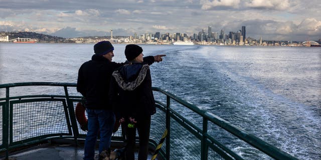 Washington ferry services are receiving $38 million in funding to improve their services. Pictured: People depart Seattle by ferry en route to Bainbridge Island on March 8, 2022.