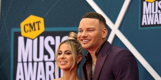 Brown, pictured here with wife Katelyn Jae, is already impressed by the musical talents of his two-year-old daughter, admitting music is a big part of their lives. 