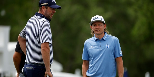 Marc Leishman, left, and Cameron Smith look on during a pro-am prior to the Zurich Classic of New Orleans at TPC Louisiana in Avondale, Louisiana, on April 20, 2022.