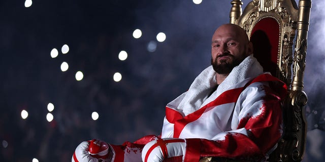 Tyson Fury sits on his throne before entering the ring prior to the WBC World Heavyweight Title Fight against Dillian Whyte at Wembley Stadium on April 23, 2022, in London.