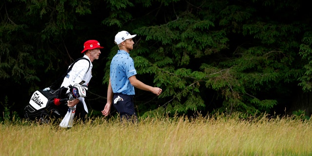 Zalatoris and caddy Ryan Goble walk the 15th hole during the final round of the 122nd U.S. Open Championship at The Country Club on June 19, 2022 in Brookline, Massachusetts.