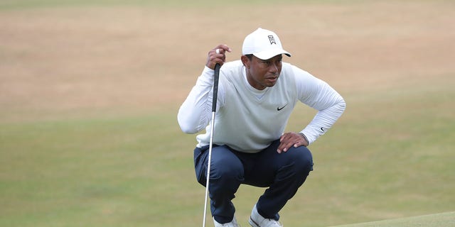 Tiger Woods prepares a shot during the 150th Open at St. Andrews Old Course on July 15, 2022, in St. Andrews, United Kingdom.