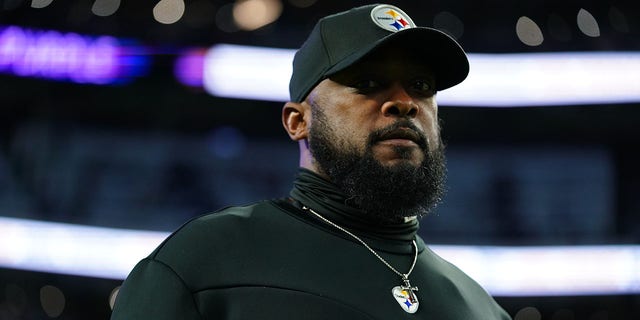 Head coach Mike Tomlin of the Pittsburgh Steelers walks on the field during a warmup against the Minnesota Vikings before an NFL game at US Bank Stadium in Minneapolis on Dec. 9, 2021. 