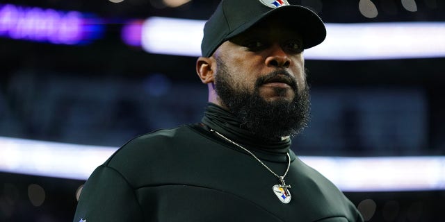 Head coach Mike Tomlin of the Pittsburgh Steelers walks on the field during a warmup against the Minnesota Vikings before an NFL game at US Bank Stadium in Minneapolis on Dec. 9, 2021. 