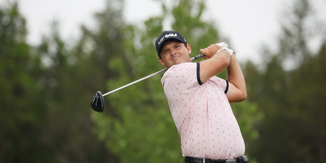 Patrick Reed, of 4 Aces GC, plays his shot from the 15th tee during day one of the LIV Golf Invitational - Bedminster at Trump National Golf Club Bedminster on July 29, 2022 in Bedminster, New Jersey.