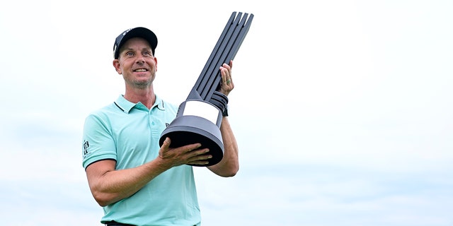 Henrik Stenson of Majesticks GC poses with the first place trophy after winning the LIV Golf Invitational Bedminster at Trump National Golf Club in Bedminster, NJ, July 31, 2022 .