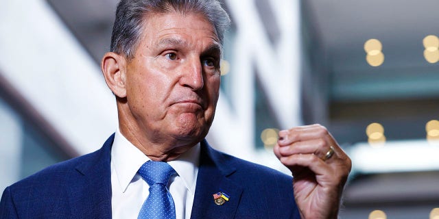 Sen.  Joe Manchin speaks to reporters in the Hart Senate Office Building in Washington.