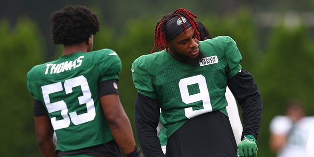 Linebackers Kwon Alexander, #9, and DQ Thomas, #53 of the New York Jets, workout during training camp at Atlantic Health Jets Training Center on August 1, 2022 in Florham Park, New Jersey.