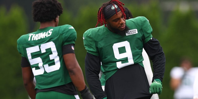 Linebackers Kwon Alexander, #9, and DQ Thomas, #53 of the New York Jets, workout during training camp at Atlantic Health Jets Training Center on August 1, 2022 in Florham Park, New Jersey.