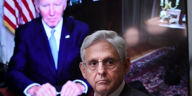 As President Joe Biden, appearing via teleconference, looks on Attorney General Merrick Garland attends a meeting of the Task Force on Reproductive Healthcare Access during an event at the White House complex August 3, 2022.