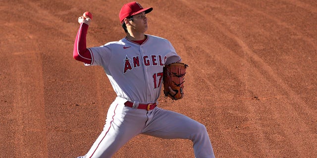 Shohei Ohtani, number 17 of the Los Angeles Angels, warms up before the start of the game against the Oakland Athletics at RingCentral Coliseum on August 9, 2022 in Oakland, California.