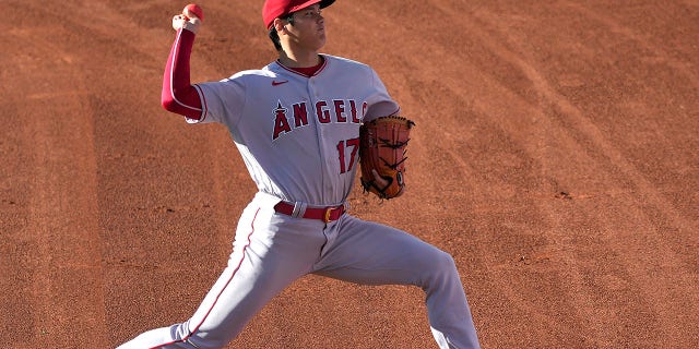 Shohei Ohtani, number 17 of the Los Angeles Angels, warms up before the start of the game against the Oakland Athletics at RingCentral Coliseum on August 9, 2022 in Oakland, California.