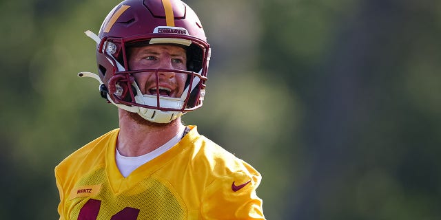 Carson Wentz of the Washington Commanders reacts during training camp at INOVA Sports Performance Center Aug. 10, 2022, in Ashburn, Va. 